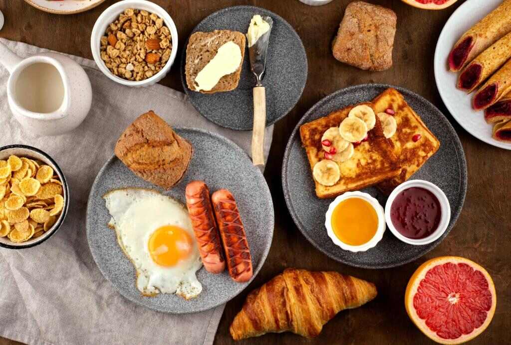 Continental buffet breakfast with pastries, eggs, fruit and croissants